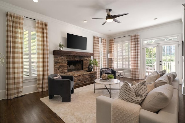 1003 N Ave NE, Atlanta, GA 30306 - living area with wood finished floors, plenty of natural light, ceiling fan, a stone fireplace, and ornamental molding