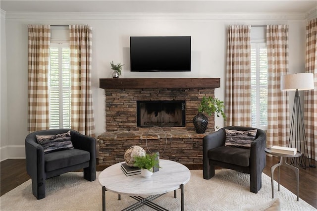 1003 N Ave NE, Atlanta, GA 30306 - living room featuring wood finished floors, crown molding, a stone fireplace, and baseboards