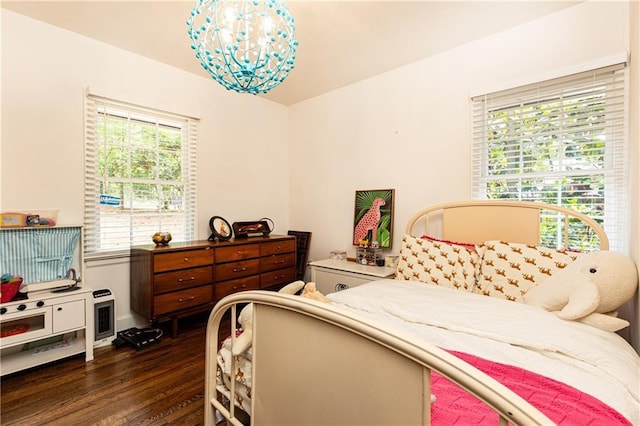 1443 Fama Dr NE, Atlanta, GA 30329 - bedroom with dark wood-style floors and a chandelier