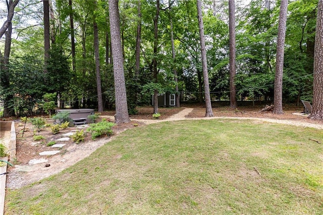 1443 Fama Dr NE, Atlanta, GA 30329 - view of green lawn with a hot tub and an outdoor structure