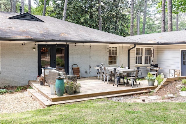 1443 Fama Dr NE, Atlanta, GA 30329 - rear view of property with a deck, brick siding, french doors, and outdoor dining space