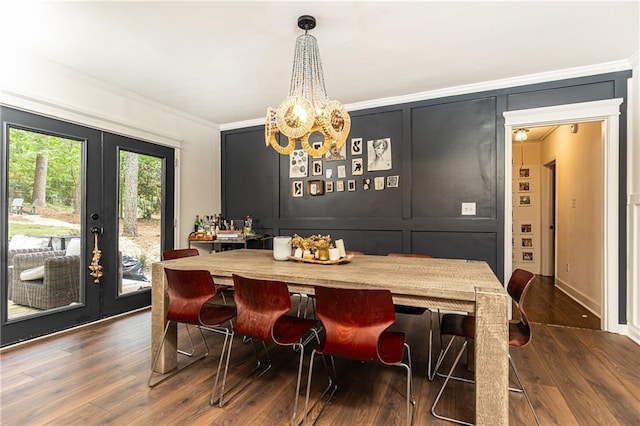 1443 Fama Dr NE, Atlanta, GA 30329 - dining room featuring a chandelier, french doors, dark wood-type flooring, ornamental molding, and a decorative wall