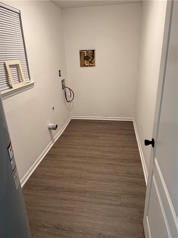 laundry area with washer hookup, laundry area, electric dryer hookup, baseboards, and dark wood-style floors