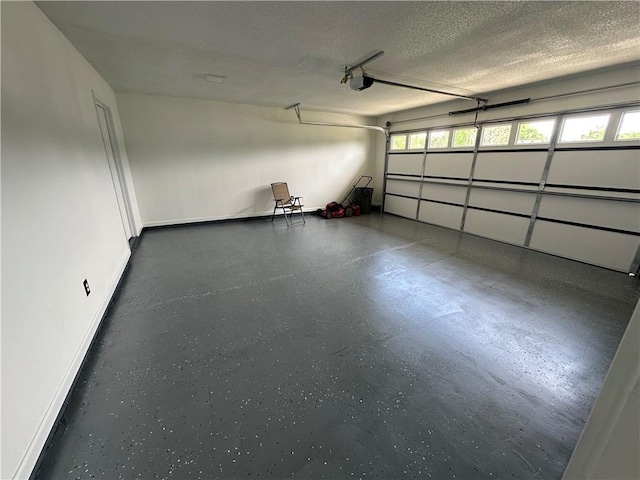 garage with baseboards and a garage door opener