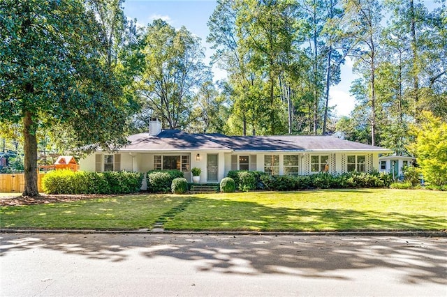 ranch-style home with a front yard