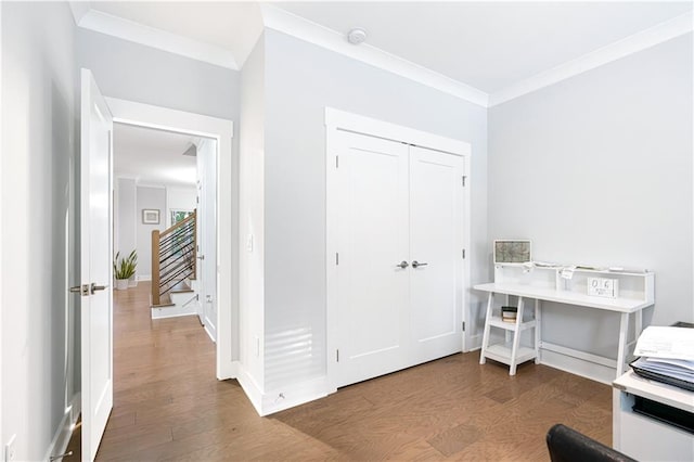 office area with dark hardwood / wood-style flooring and ornamental molding