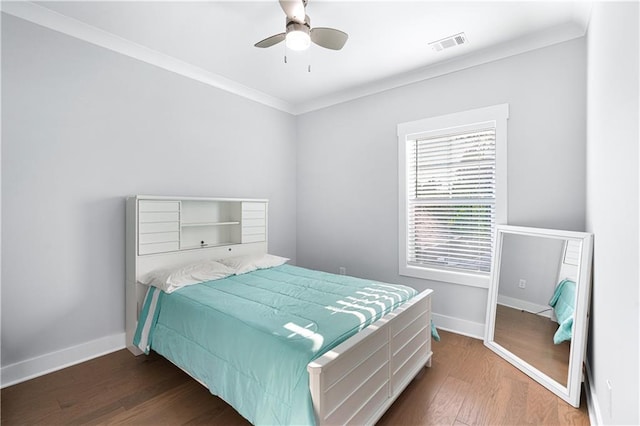 bedroom featuring ceiling fan, dark hardwood / wood-style flooring, and ornamental molding