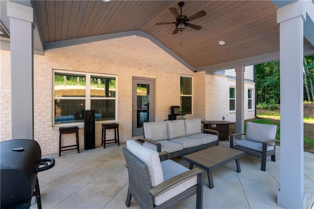 view of patio with ceiling fan and an outdoor living space