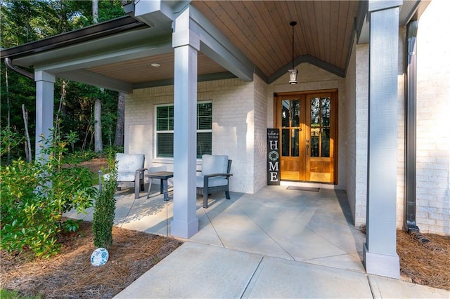 view of exterior entry featuring french doors