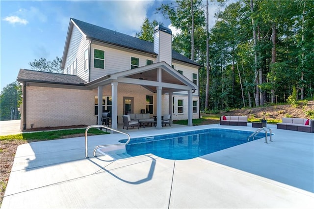 view of pool featuring a patio and outdoor lounge area