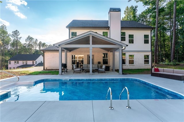 view of pool featuring a patio area and an outdoor living space