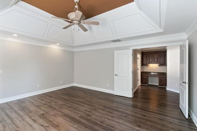 unfurnished living room featuring ornamental molding, dark hardwood / wood-style floors, built in desk, and ceiling fan