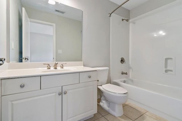 full bathroom featuring vanity, tile patterned flooring, toilet, and shower / bath combination