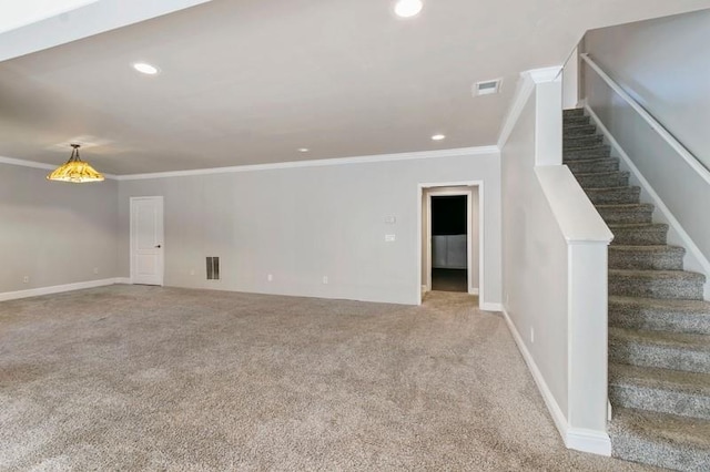 interior space with ornamental molding and carpet floors