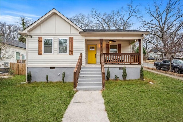 bungalow-style house with ceiling fan, a porch, and a front yard