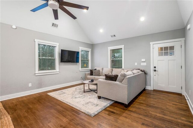 living room with ceiling fan, high vaulted ceiling, and dark hardwood / wood-style flooring