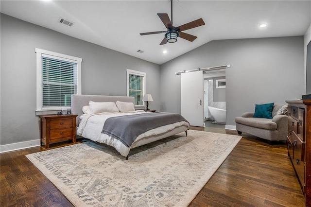 1375 Miller Reed Ave SE, Atlanta, GA 30315 - bedroom with visible vents, a barn door, baseboards, lofted ceiling, and dark wood-type flooring