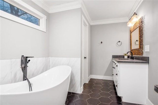 1375 Miller Reed Ave SE, Atlanta, GA 30315 - bathroom featuring a freestanding bath, vanity, tile patterned floors, tile walls, and ornamental molding