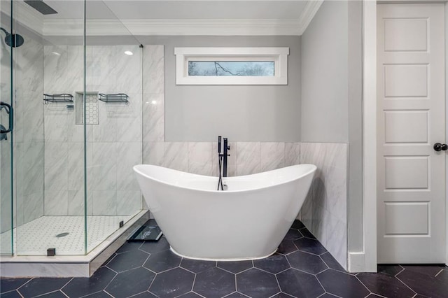 bathroom featuring independent shower and bath, crown molding, and tile walls