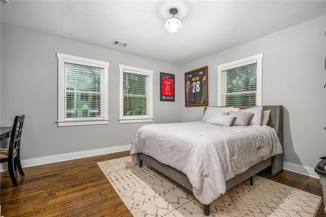 1375 Miller Reed Ave SE, Atlanta, GA 30315 - bedroom featuring baseboards, visible vents, multiple windows, and dark wood-type flooring