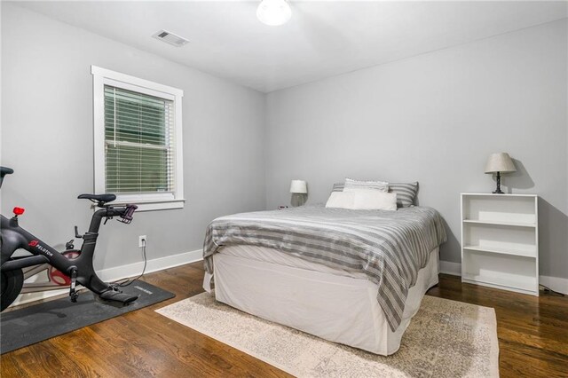 bedroom featuring dark hardwood / wood-style flooring