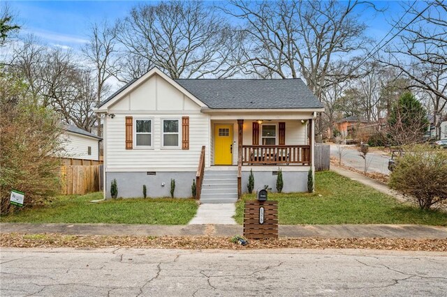 bungalow-style house featuring a front lawn and a porch