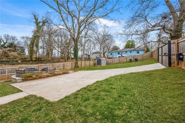 view of yard featuring a patio area and a shed