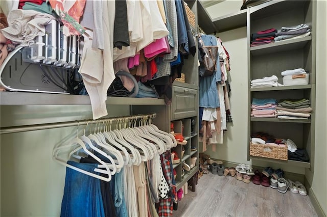 spacious closet with light hardwood / wood-style floors