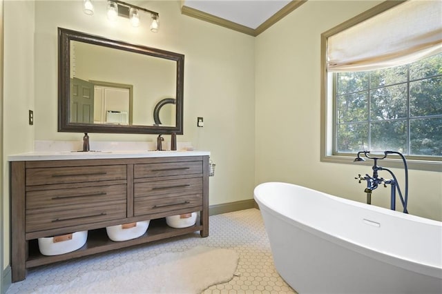 bathroom featuring a tub, ornamental molding, vanity, and tile patterned floors