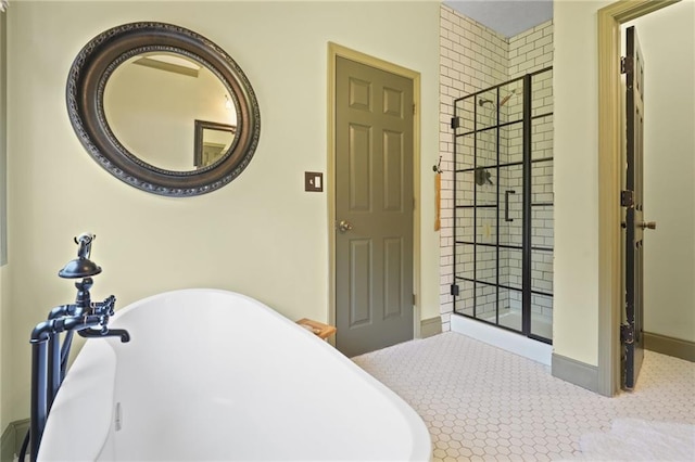 bathroom featuring separate shower and tub