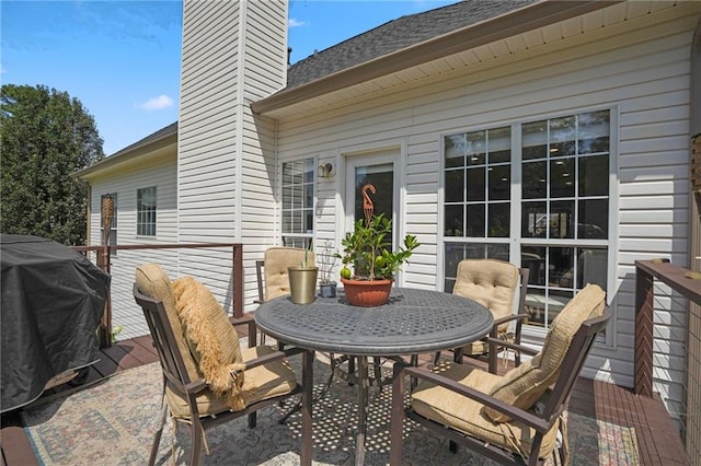 wooden deck featuring area for grilling