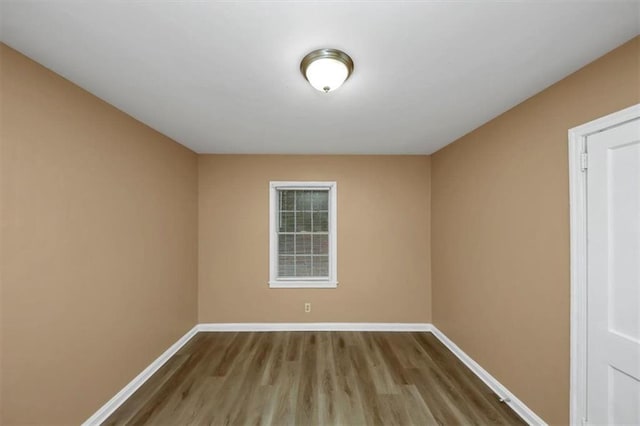 spare room featuring light wood-type flooring