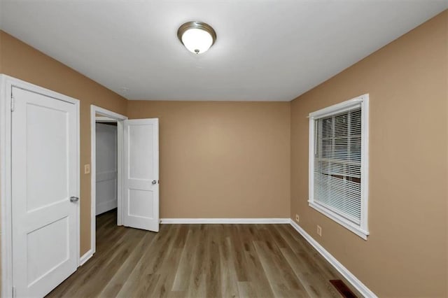 unfurnished bedroom with light wood-type flooring