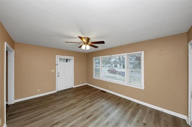 unfurnished room featuring hardwood / wood-style flooring and ceiling fan