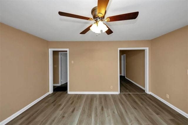 unfurnished bedroom featuring ceiling fan and hardwood / wood-style floors