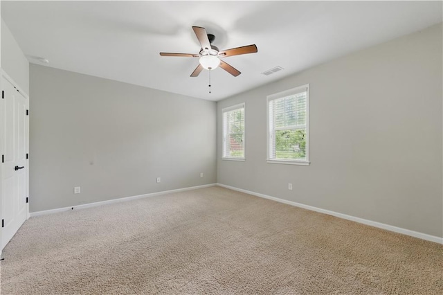 2828 Broughton Ln SE, Atlanta, GA 30339 - spare room with ceiling fan, baseboards, and light carpet
