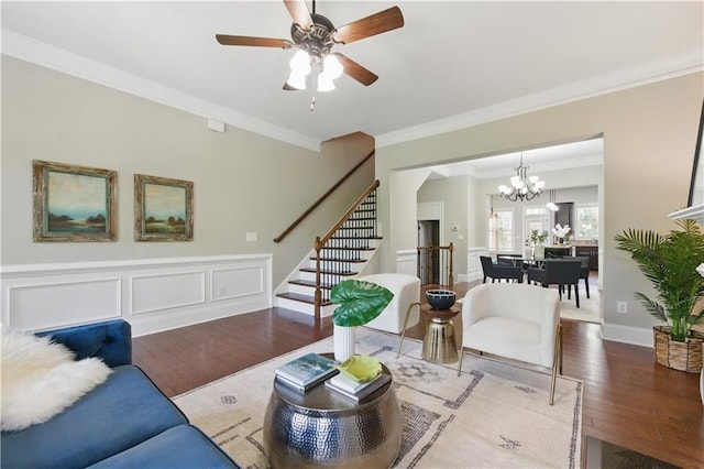 2828 Broughton Ln SE, Atlanta, GA 30339 - living room with wood finished floors, stairs, ornamental molding, ceiling fan, and a chandelier
