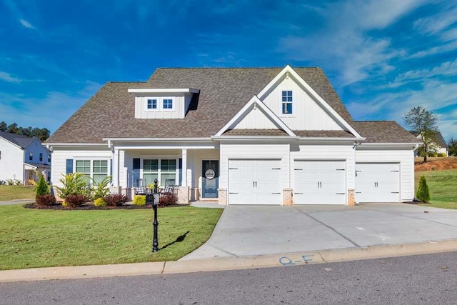 craftsman inspired home with a porch and a front yard