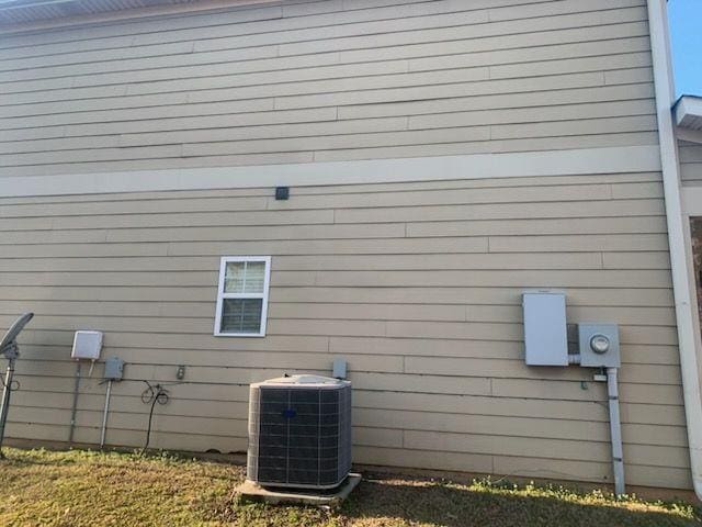 9590 English Ivy Ct, Fortson, GA 31808 - view of side of property with central AC unit
