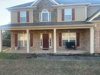 9590 English Ivy Ct, Fortson, GA 31808 - view of front of house featuring a porch and brick siding