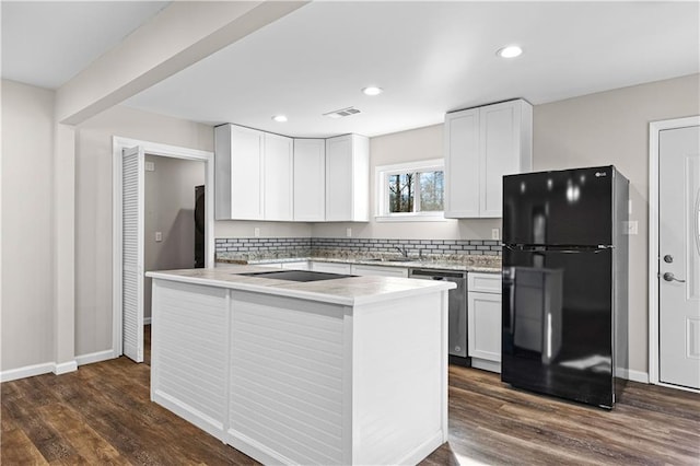 kitchen featuring white cabinetry, sink, dark wood-type flooring, and black appliances