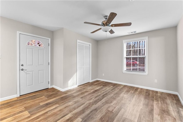 unfurnished bedroom with a closet, ceiling fan, and light hardwood / wood-style flooring