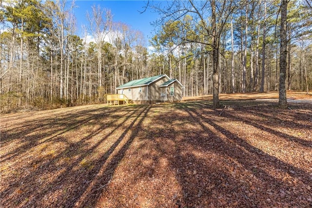 view of yard featuring a wooden deck