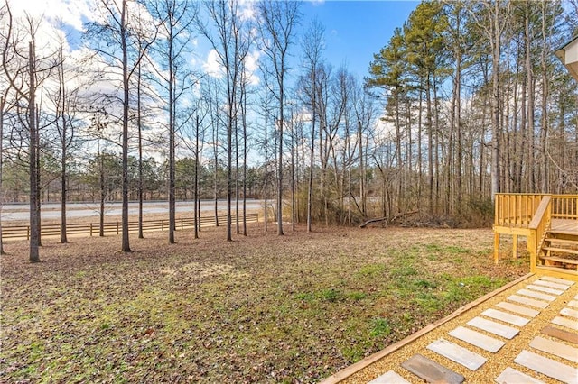 view of yard featuring a wooden deck