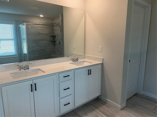 bathroom with vanity and an enclosed shower