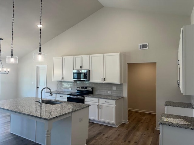 kitchen with white cabinetry, high vaulted ceiling, stainless steel appliances, and sink