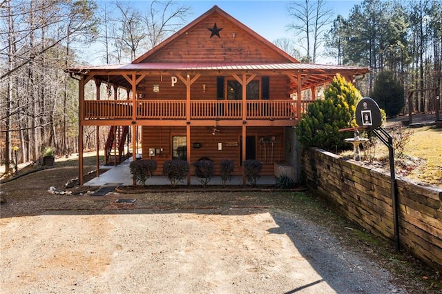 view of front of property featuring a patio area and a deck