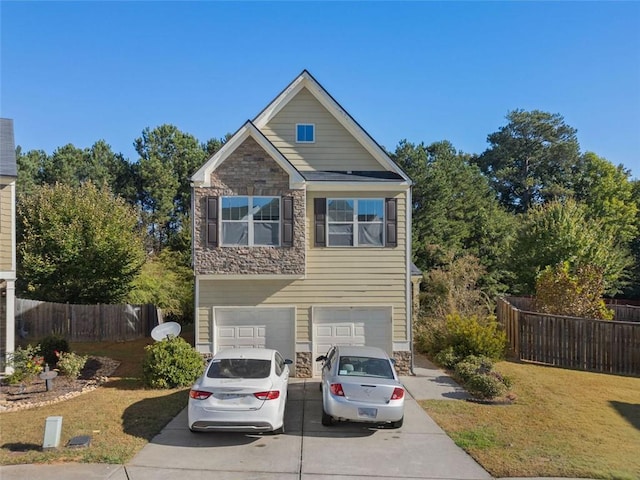 view of front facade with a front lawn, fence, a garage, stone siding, and driveway