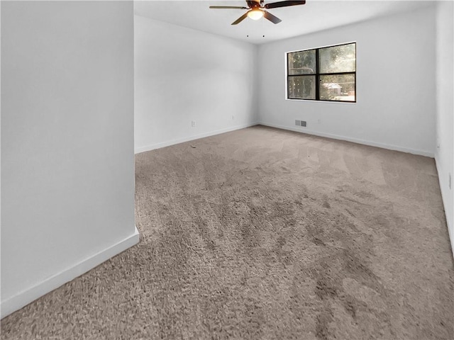 empty room with carpet and ceiling fan