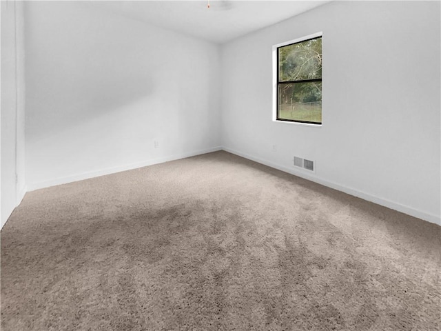 empty room featuring carpet floors